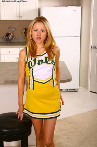 Sexy Cheer Girl Sindee Jennings With Neat Pussy Pulls Off Her Yellow Uniform And Panties on nudesceleb.com