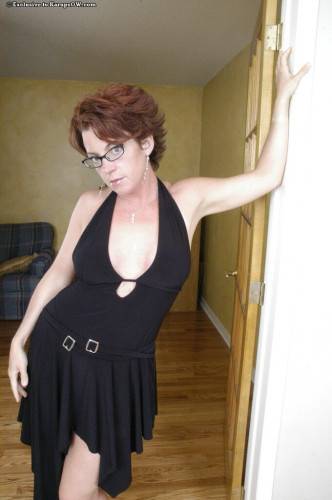 Spectacled Big Titted Milf Holly Goes Pulls Off Her Black Dress And Pink Panties on nudesceleb.com