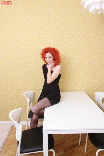 Passionate Redhead Babe In Sexy Black Dress Foxy Zee Shows Her Slit On The Table on nudesceleb.com