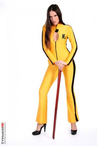 Deny Is Such A Hot Brunette, Dressed In A Kill-bill Style Yellow Suit Looking Sexy. on nudesceleb.com