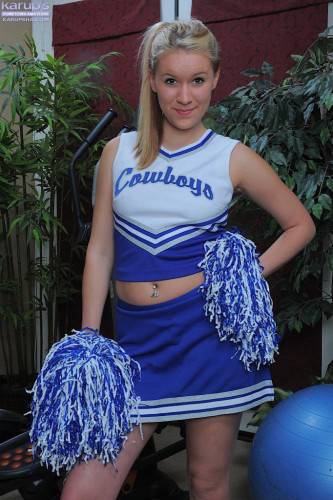 Cheerleader Kristi Kay Takes Off Her Blue Uniform And Displays Her Smooth Pink Pussy on nudesceleb.com