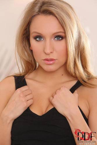 Cute Blonde Teen Nessy Wild Is About To Take Her Black Dress Off And Pose. on nudesceleb.com