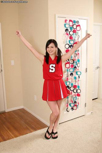 Skinny Flat Chested Kitty Ashli Orion Strips Out Of Her Red And White Uniform on nudesceleb.com