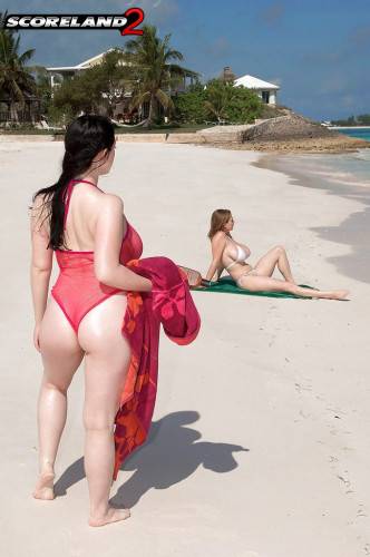 Lush girls Angela White and Christy Marks kissing andhaving fun with toy on the beach on nudesceleb.com