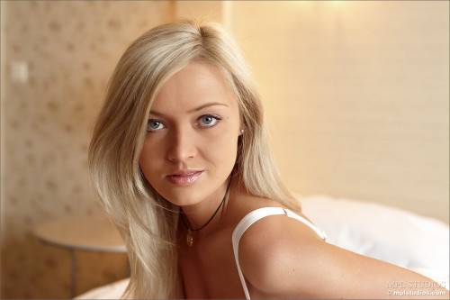 Lusty Blonde Hottie In Lingerie Nelly A Enjoys In Stripping And Teasing On The Bed on nudesceleb.com