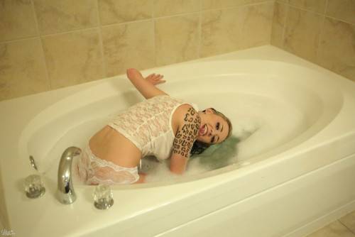 Aroused Passionate Lily Xo Poses In The Bath Tub And Teases With Pleasure on nudesceleb.com