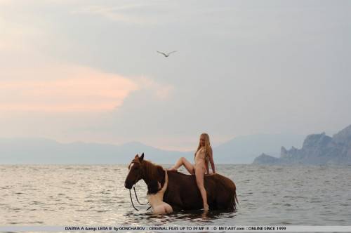 Naked Slender Lesbian Friends Dariya A And Lera B Ride The Horse Naked Together At The Seaside on nudesceleb.com