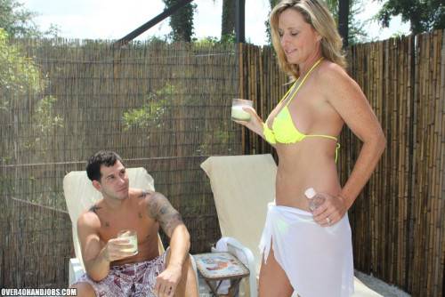 Busty Blonde MILF Jodi West Wraps Her Arms Around A Young Stud And Blows His Boner Poolside. on nudesceleb.com